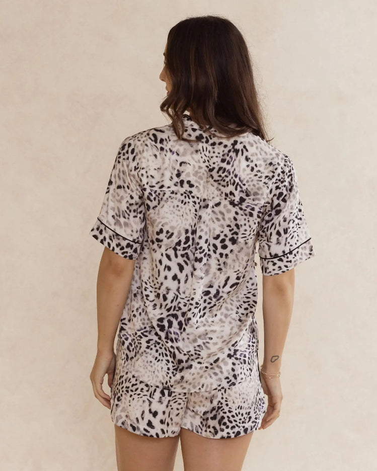 Woman wearing animal print bamboo pyjama set – soft, breathable luxury sleepwear for women designed in Australia.