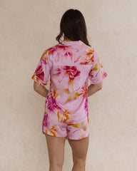 Back view of a woman wearing a pink floral bamboo pyjama set – soft, breathable luxury sleepwear for women designed in Australia