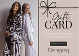 Dawn & Dusk Co. gift card with a photo of two women smiling in their silky soft bamboo loungewear. Text reads "Treat yourself to loungewear you won't want to take off".