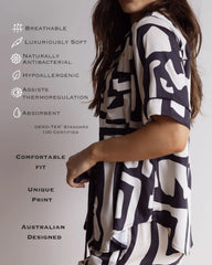 Short pyjama set with button down top and shorts, hidden pockets and all the benefits of the product listed alongside.