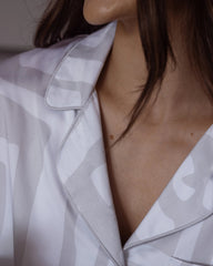 Close-up of silky-soft bamboo satin pyjama collar with piping – luxury sleepwear