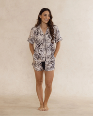 Woman wearing a bamboo animal print short pyjama set – soft, breathable luxury sleepwear for women designed in Australia.