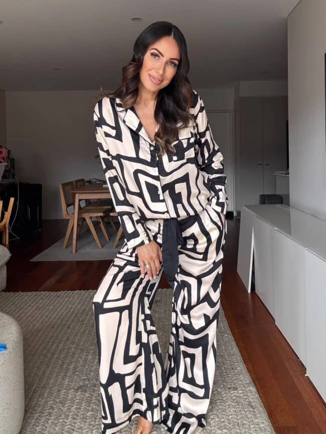 Customer wearing silky soft bamboo satin pyjama set in a bold geometric print.