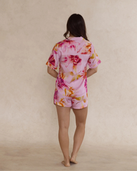 Back view of a woman wearing a pink floral bamboo pyjama set – soft, breathable luxury sleepwear for women designed in Australia