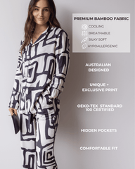 Woman wearing a geometric long pyjama set with text highlighting features. Australian designed, unique print, pockets and comfortable fit. Premium bamboo fabric that is cooling cooling, silky soft and hypoallergenic.