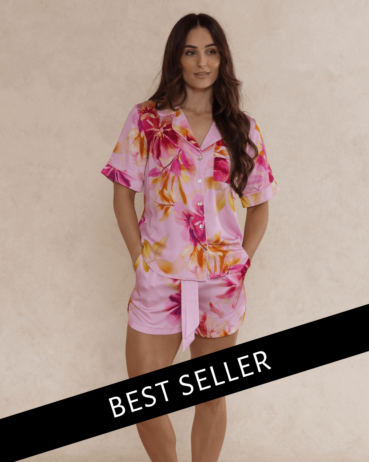 Woman wearing a pink floral bamboo pyjama set – soft, breathable luxury sleepwear for women designed in Australia. Best Seller.