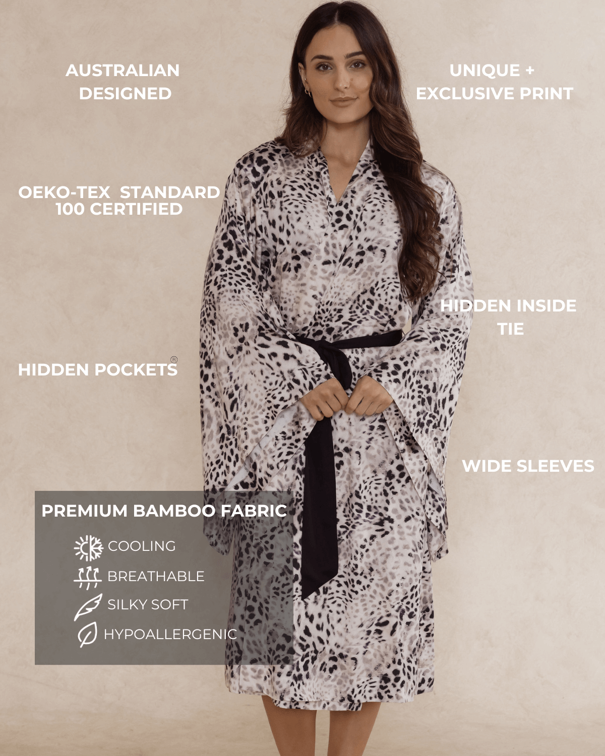Woman wearing a leopard print kimono-style robe with text highlighting features.  With wide sleeves, hidden pockets. Premium bamboo fabric that is cooling cooling, silky soft and hypoallergenic.