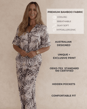 Woman wearing a leopard print pant pyjama set with text highlighting features.  Premium bamboo fabric that is cooling cooling, silky soft and hypoallergenic. Australian designed, unique print, hidden pockets, comfortable fit.