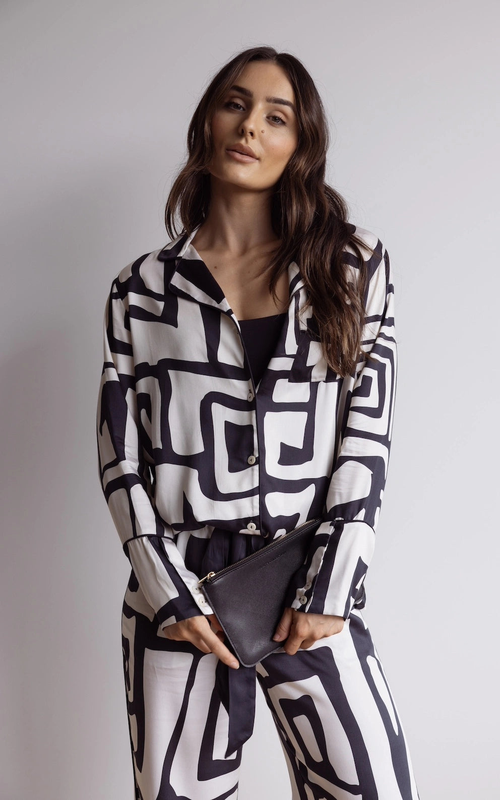 Luxury women’s loungewear – satin bamboo pyjamas for comfort and style. Black and cream geometric print.